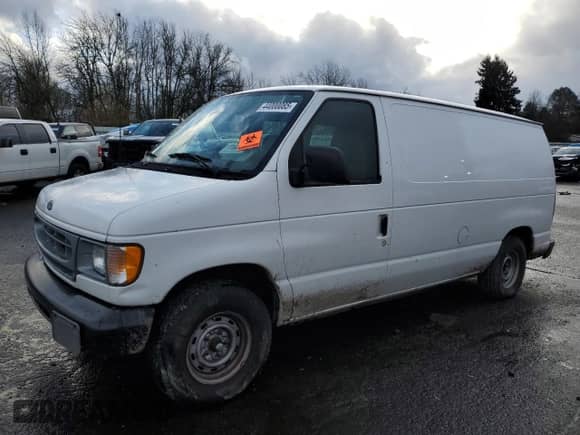 2001 Ford Econoline Cargo with VIN 1FTRE14251HA20435, listed as a Copart auction lot 44000085 with 69,015 mi miles and Salvage title. Bid and sale history available at DreamBid. Image 1.