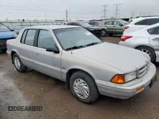 1993 Dodge Spirit z VIN 3B3XA4632PT520185, wystawiony jako Copart lot #54891565 z przebiegiem 125 574 mil mil oraz Szkoda całkowita • Salvage title. Historia ofert i sprzedaży dostępna na DreamBid. Obrazek 4.