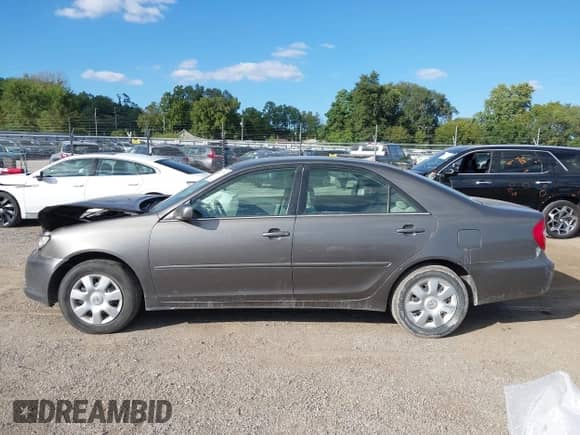 2003 Toyota Camry LE z VIN 4T1BE32K83U787363, wystawiony jako IAAI lot #43317793 z przebiegiem 236 846 mil mil oraz . Historia ofert i sprzedaży dostępna na DreamBid. Obrazek 14.