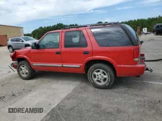 2000 Chevrolet Blazer LT z VIN 1GNDT13W6Y2169669, wystawiony jako Copart lot #70088314 z przebiegiem 131 671 mil mil oraz Szkoda całkowita • Salvage title. Historia ofert i sprzedaży dostępna na DreamBid. Obrazek 2.