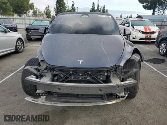 2023 Tesla Model Y Performance with VIN 7SAYGDEF7PF958571, listed as a Copart auction lot 84988605 with 40,428 mi miles and Salvage title. Bid and sale history available at DreamBid. Image 5.