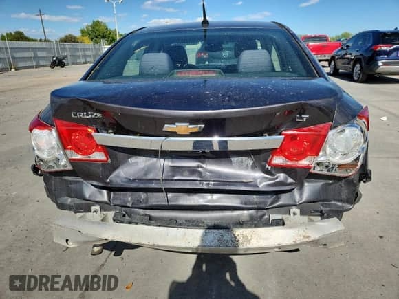 2014 Chevrolet Cruze 1LT z VIN 1G1PC5SB4E7109277, wystawiony jako Copart lot #82177785 z przebiegiem 120 436 mil mil oraz Szkoda całkowita • Salvage title. Historia ofert i sprzedaży dostępna na DreamBid. Obrazek 6.