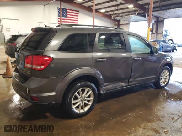 2015 Dodge Journey SXT with VIN 3C4PDCBG3FT742435, listed as a Copart auction lot 60710055 with 96,373 mi miles and Salvage title. Bid and sale history available at DreamBid. Image 3.