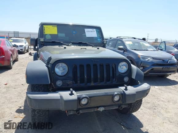 2015 Jeep Wrangler Sport with VIN 1C4AJWAGXFL650428, listed as a IAAI auction lot 42010629 with 80,039 mi miles and . Bid and sale history available at DreamBid. Image 12.