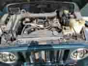 2001 Jeep Wrangler Sahara z VIN 1J4FA59S21P349009, wystawiony jako Copart lot #57588205 z przebiegiem 235 268 mil mil oraz Czysty tytuł • Clean title. Historia ofert i sprzedaży dostępna na DreamBid. Obrazek 12.