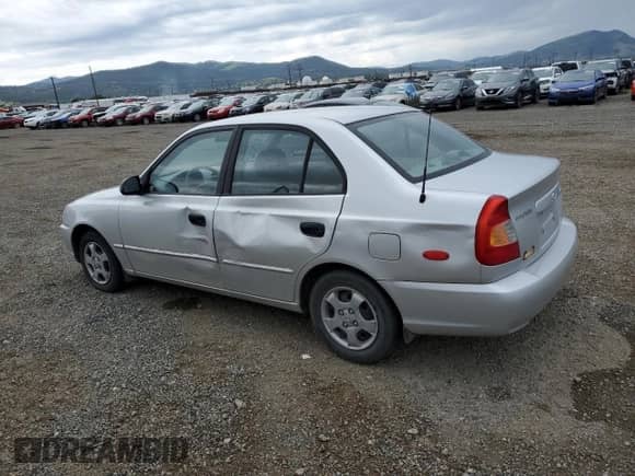 2000 Hyundai Accent with VIN KMHCG45G8YU120795, listed as a Copart auction lot 61005175 with 96,515 mi miles and Clean title. Bid and sale history available at DreamBid. Image 2.
