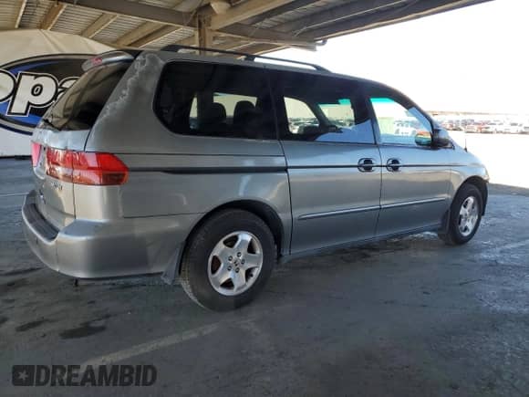 2001 Honda Odyssey EX with VIN 2HKRL18621H606756, listed as a Copart auction lot 85207295 with 301,823 mi miles and Salvage title. Bid and sale history available at DreamBid. Image 3.