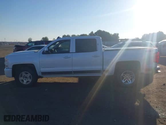 2016 Chevrolet Silverado 1500 LT z VIN 3GCUKREC5GG276375, wystawiony jako IAAI lot #43577857 z przebiegiem 125 238 mil mil oraz . Historia ofert i sprzedaży dostępna na DreamBid. Obrazek 14.