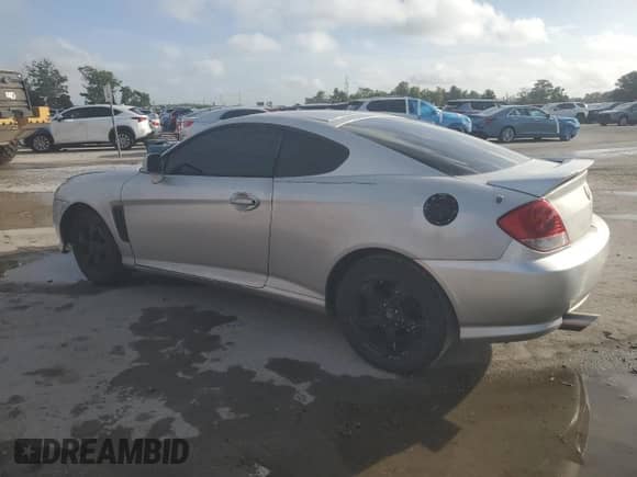 2006 Hyundai Tiburon GS с VIN KMHHM65D76U222358, выставлен на аукционе Copart как лот 64834055 с пробегом 129 477 миль миль и Списание • Salvage title. История ставок и продаж доступна на DreamBid. Изображение 2.