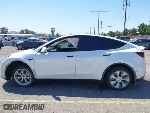 2023 Tesla Model Y Long Range z VIN 7SAYGDEE9PA081036, wystawiony jako IAAI lot #43151161 z przebiegiem 49 637 mil mil oraz . Historia ofert i sprzedaży dostępna na DreamBid. Obrazek 14.