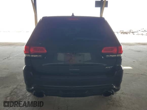 2015 Jeep Grand Cherokee SRT с VIN 1C4RJFDJ1FC620521, выставлен на аукционе Copart как лот 70182775 с пробегом 113 937 миль миль и Списание • Salvage title. История ставок и продаж доступна на DreamBid. Изображение 6.