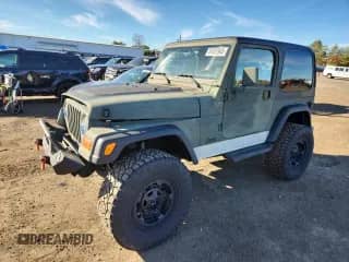 2001 Jeep Wrangler Sport z VIN 1J4FA49S41P361740, wystawiony jako Copart lot #87027945 z przebiegiem 215 668 mil mil oraz Szkoda całkowita • Salvage title. Historia ofert i sprzedaży dostępna na DreamBid. Obrazek 1.