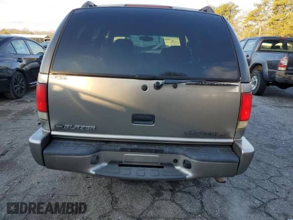 2000 Chevrolet Blazer LS z VIN 1GNCS13W6Y2365299, wystawiony jako Copart lot #41368365 z przebiegiem 144 294 mil mil oraz Szkoda całkowita • Salvage title. Historia ofert i sprzedaży dostępna na DreamBid. Obrazek 6.