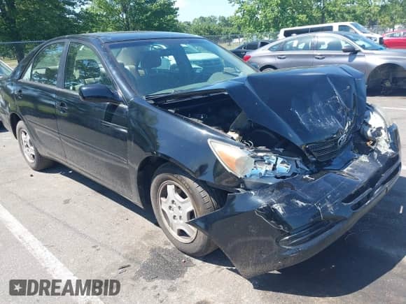 2002 Toyota Camry XLE with VIN 4T1BF32K22U503284, listed as a IAAI auction lot 42563001 with 138,316 mi miles and . Bid and sale history available at DreamBid. Image 1.