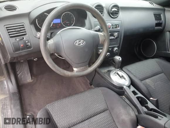 2008 Hyundai Tiburon GS с VIN KMHHM66D48U265203, выставлен на аукционе Copart как лот 49837525 с пробегом 104 259 миль миль и Чистый • Clean title. История ставок и продаж доступна на DreamBid. Изображение 8.
