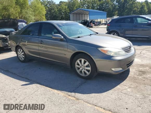 2003 Toyota Camry LE with VIN 4T1BE32K03U726024, listed as a Copart auction lot 84419085 with 129,574 mi miles and Clean title. Bid and sale history available at DreamBid. Image 4.