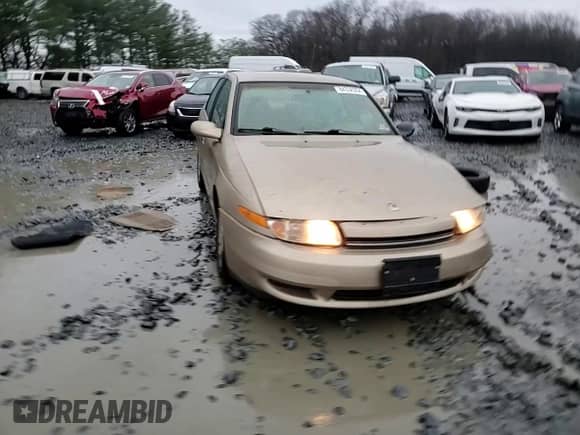 2001 Saturn LS with VIN 1G8JU52FX1Y566803, listed as a Copart auction lot 84338304 with 144,674 mi miles and Salvage title. Bid and sale history available at DreamBid. Image 11.