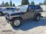 1997 Jeep Wrangler Sport with VIN 1J4FY19S0VP543158, listed as a Copart auction lot 80878565 with 301,693 mi miles and Salvage title. Bid and sale history available at DreamBid. Image 1.