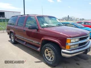 1999 Chevrolet Suburban with VIN 1GBFK16R5XJ335005, listed as a IAAI auction lot 42542755 with 200,599 mi miles and . Bid and sale history available at DreamBid. Image 1.