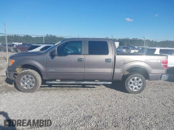 2013 Ford F-150 Lariat with VIN 1FTFW1ET5DKE51436, listed as a IAAI auction lot 43459885 with 149,455 mi miles and . Bid and sale history available at DreamBid. Image 14.