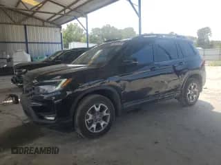 2023 Honda Passport TrailSport с VIN 5FNYF8H69PB003130, выставлен на аукционе Copart как лот 69781425 с пробегом 78 089 миль миль и Списание • Salvage title. История ставок и продаж доступна на DreamBid. Изображение 1.