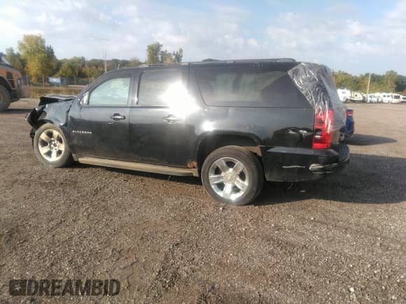 2011 Chevrolet Suburban LT with VIN 1GNSKJE32BR328845, listed as a IAAI auction lot 43211739 with 196,574 mi miles and . Bid and sale history available at DreamBid. Image 3.