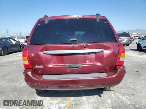 2002 Jeep Grand Cherokee Laredo with VIN 1J4GX48SX2C310790, listed as a Copart auction lot 85556515 with 165,485 mi miles and Salvage title. Bid and sale history available at DreamBid. Image 6.