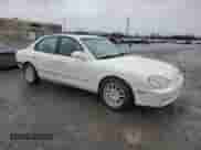 1999 Hyundai Sonata GLS z VIN KMHWF35VXXA049804, wystawiony jako Copart lot #44175995 z przebiegiem 123 322 mil mil oraz Szkoda całkowita • Salvage title. Historia ofert i sprzedaży dostępna na DreamBid. Obrazek 4.