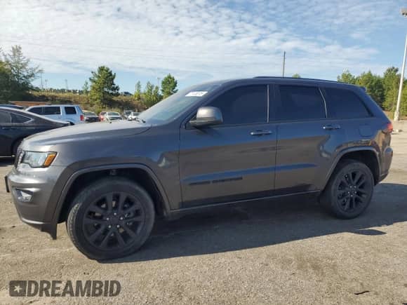 2018 Jeep Grand Cherokee Altitude with VIN 1C4RJFAG9JC465962, listed as a Copart auction lot 71133015 with Not provided miles and Salvage title. Bid and sale history available at DreamBid. Image 1.