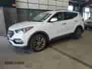 2018 Hyundai Santa Fe 2.0T z VIN 5XYZUDLAXJG525229, wystawiony jako Copart lot #69979755 z przebiegiem 73 876 mil mil oraz Czysty tytuł • Clean title. Historia ofert i sprzedaży dostępna na DreamBid. Obrazek 1.