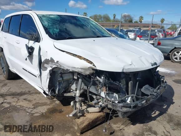 2018 Jeep Grand Cherokee Laredo E with VIN 1C4RJEAG4JC193539, listed as a IAAI auction lot 41827154 with 79,784 mi miles and . Bid and sale history available at DreamBid. Image 6.