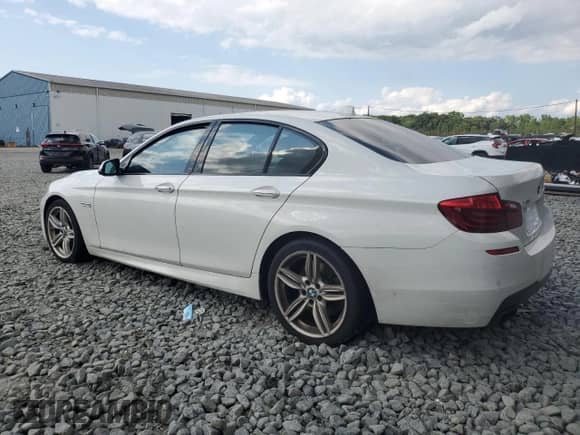2016 BMW 5 Series 550i xDrive with VIN WBAKP9C55GD981149, listed as a Copart auction lot 65976265 with 121,838 mi miles and Salvage title. Bid and sale history available at DreamBid. Image 2.