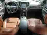 2015 Hyundai Santa Fe с VIN 5XYZWDLAXFG254951, выставлен на аукционе Copart как лот 72043145 с пробегом 102 181 миль миль и Списание • Salvage title. История ставок и продаж доступна на DreamBid. Изображение 8.