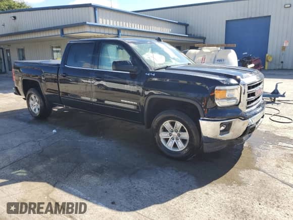 2015 GMC Sierra 1500 SLE with VIN 3GTU2UECXFG103453, listed as a Copart auction lot 86623595 with 160,739 mi miles and Salvage title. Bid and sale history available at DreamBid. Image 4.