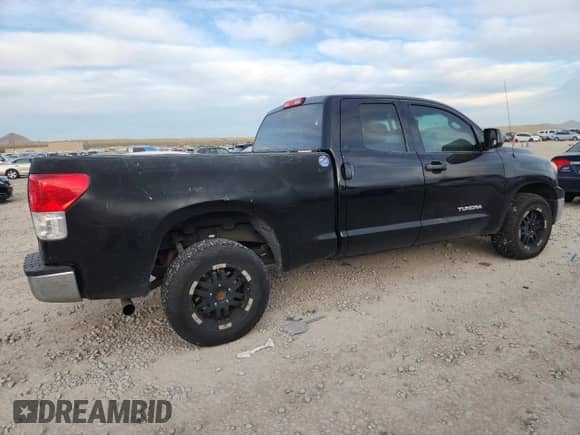 2010 Toyota Tundra with VIN 5TFUM5F15AX011202, listed as a Copart auction lot 82741795 with 181,867 mi miles and Clean title. Bid and sale history available at DreamBid. Image 3.