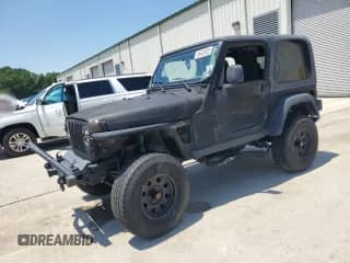 2004 Jeep Wrangler Rubicon with VIN 1J4FA69S74P769357, listed as a Copart auction lot 65425525 with 125,486 mi miles and Salvage title. Bid and sale history available at DreamBid. Image 1.