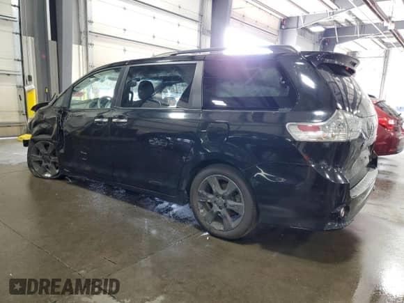 2014 Toyota Sienna SE with VIN 5TDXK3DC7ES482016, listed as a Copart auction lot 69857475 with 136,304 mi miles and Salvage title. Bid and sale history available at DreamBid. Image 2.