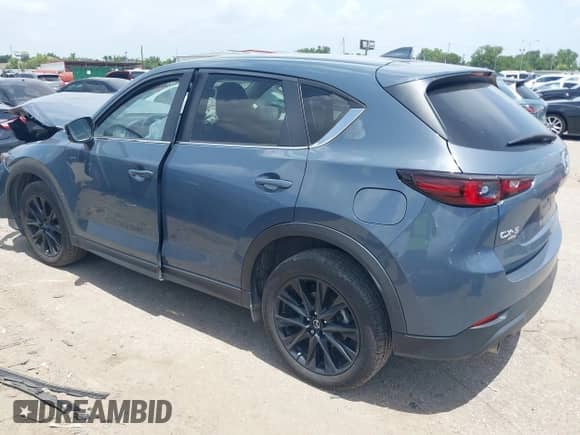 2022 Mazda CX-5 S Carbon Edition z VIN JM3KFBCM2N0571117, wystawiony jako IAAI lot #42535593 z przebiegiem 33 735 mil mil oraz . Historia ofert i sprzedaży dostępna na DreamBid. Obrazek 3.