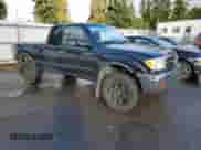 2000 Toyota Tacoma with VIN 5TEWN72N3YZ700698, listed as a Copart auction lot 90316805 with 176,401 mi miles and Salvage title. Bid and sale history available at DreamBid. Image 4.