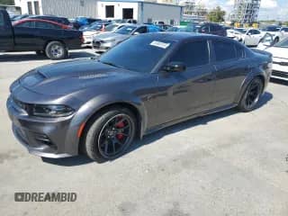 2023 Dodge Charger SRT Hellcat Redeye Widebody с VIN 2C3CDXL94PH503237, выставлен на аукционе Copart как лот 83869155 с пробегом 27 372 миль миль и Списание • Salvage title. История ставок и продаж доступна на DreamBid. Изображение 1.