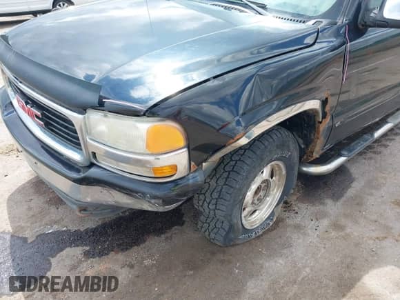 2000 GMC Sierra 1500 SLE z VIN 1GTEK19T8YZ313906, wystawiony jako IAAI lot #42383243 z przebiegiem 134 150 mil mil oraz . Historia ofert i sprzedaży dostępna na DreamBid. Obrazek 6.