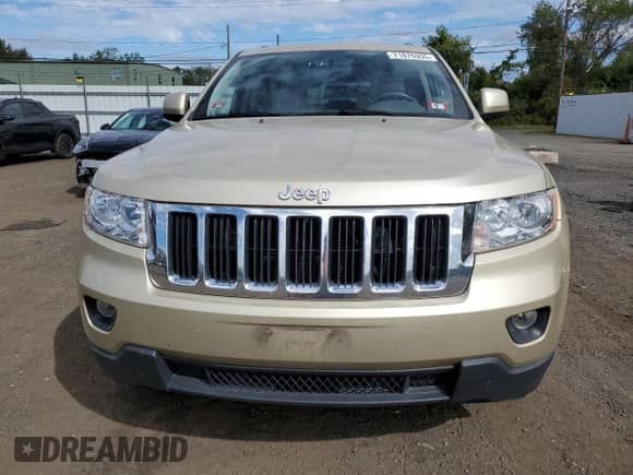 2011 Jeep Grand Cherokee 70th Anniversary with VIN 1J4RR4GGXBC563334, listed as a Copart auction lot 71876355 with 104,989 mi miles and Clean title. Bid and sale history available at DreamBid. Image 5.