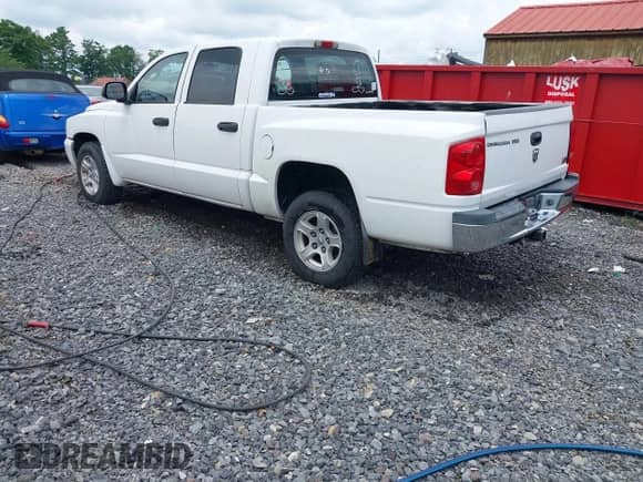 2006 Dodge Dakota SLT z VIN 1D7HW48N66S524247, wystawiony jako IAAI lot #42442778 z przebiegiem 71 419 mil mil oraz . Historia ofert i sprzedaży dostępna na DreamBid. Obrazek 3.