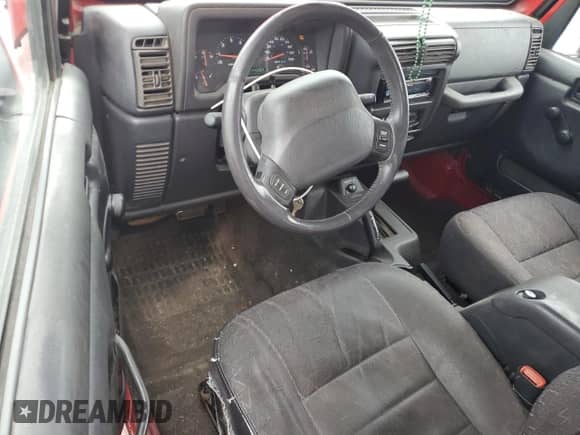 2001 Jeep Wrangler Sport with VIN 1J4FA49S11P339047, listed as a Copart auction lot 85923625 with 144,267 mi miles and Salvage title. Bid and sale history available at DreamBid. Image 8.