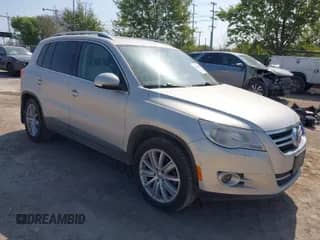 2011 Volkswagen Tiguan S with VIN WVGBV7AX9BW524886, listed as a IAAI auction lot 41828847 with 199,813 mi miles and . Bid and sale history available at DreamBid. Image 1.