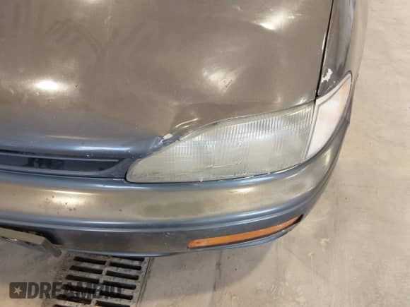 1996 Toyota Camry DX z VIN 4T1BG12K9TU949712, wystawiony jako IAAI lot #42982766 z przebiegiem 258 942 mil mil oraz . Historia ofert i sprzedaży dostępna na DreamBid. Obrazek 6.