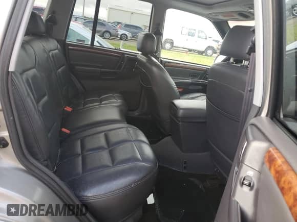 1998 Jeep Grand Cherokee Limited z VIN 1J4GZ78S2WC222768, wystawiony jako Copart lot #73942154 z przebiegiem Nie podano mil oraz Szkoda całkowita • Salvage title. Historia ofert i sprzedaży dostępna na DreamBid. Obrazek 10.