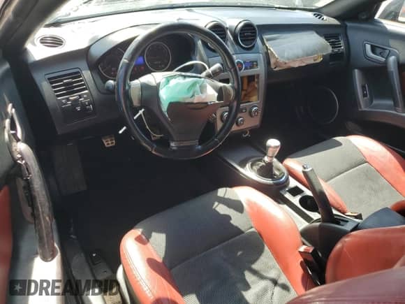 2008 Hyundai Tiburon GT с VIN KMHHN66F18U295838, выставлен на аукционе Copart как лот 51972325 с пробегом 147 626 миль миль и Списание • Salvage title. История ставок и продаж доступна на DreamBid. Изображение 8.