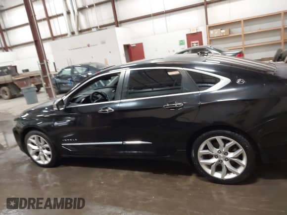 2014 Chevrolet Impala LTZ with VIN 1G1145SLXEU149313, listed as a IAAI auction lot 42386535 with 153,304 mi miles and . Bid and sale history available at DreamBid. Image 14.