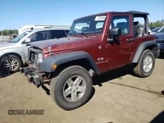 2007 Jeep Wrangler X z VIN 1J4FA24197L123725, wystawiony jako Copart lot #70392965 z przebiegiem 65 691 mil mil oraz Szkoda całkowita • Salvage title. Historia ofert i sprzedaży dostępna na DreamBid. Obrazek 1.